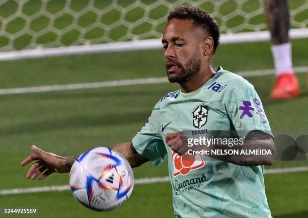 Brazil's forward Neymar takes part in a training session at the Al Arabi SC Stadium in Doha on November 20 just moments before the kick-off of the...
