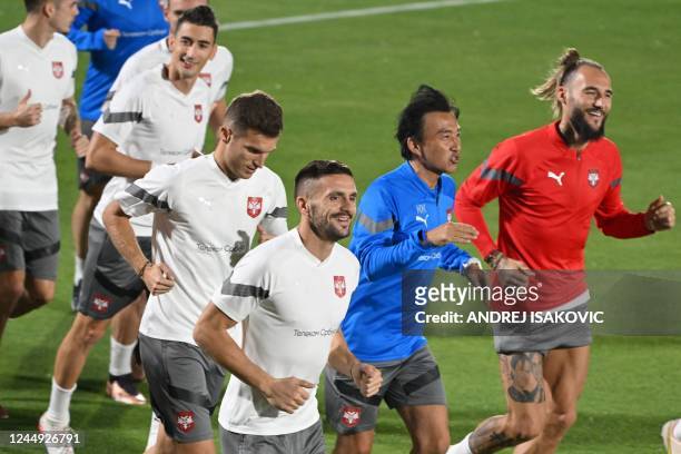 Serbia's forward Dusan Tadic takes part in a training session at the Al Wakrah SC Stadium in Al Wakrah, south of Doha, on November 20 on the eve of...