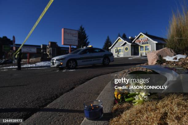 Bouquet of flowers is left near Club Q, an LGBTQ nightclub in Colorado Springs, Colorado, on November 20, 2022. - At least five people were killed...