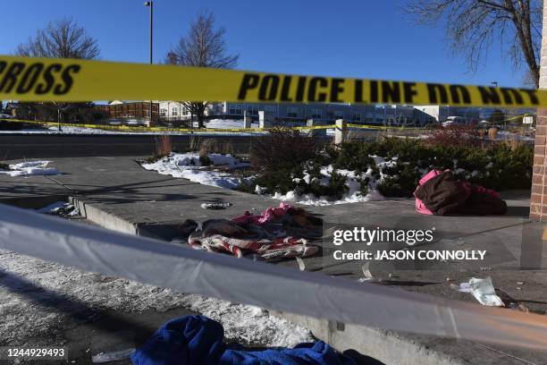 Blood stained clothing is seen on the ground near Club Q, an LGBTQ nightclub in Colorado Springs, Colorado, on November 20, 2022. - At least five...