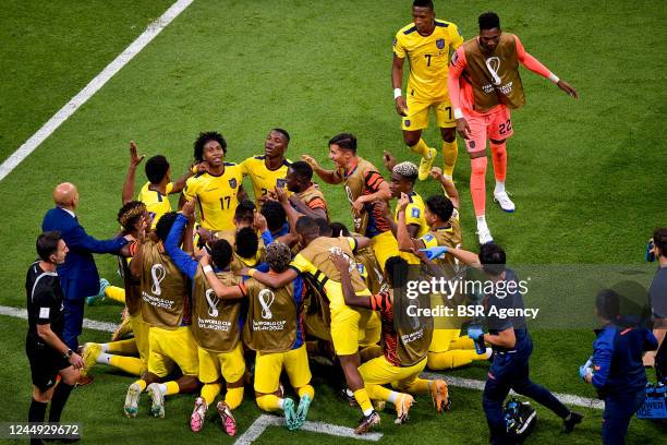 Enner Valencia of Ecuador celebrates after scoring his sides second goal with Jhegson Mendez of Ecuador and teammates during the Group A - FIFA World...