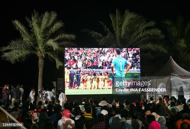 Habitants and workers from Al Ruwais watch the Qatar 2022 World Cup Group A football match between Qatar and Ecuador, at a public viewing in Al...