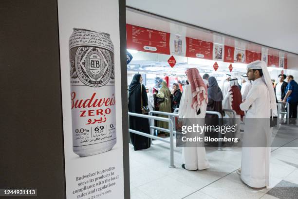 An Anheuser-Busch Budweiser Zero brand beer advertisement as customers wait at a food stand ahead of the first match of the FIFA World Cup at Al Bayt...
