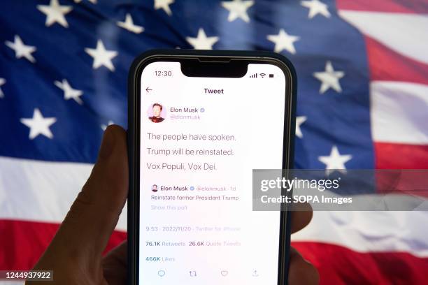 In this photo illustration, Elon Musk's tweet about his decision to reinstate former US President Donald Trump on Twitter.