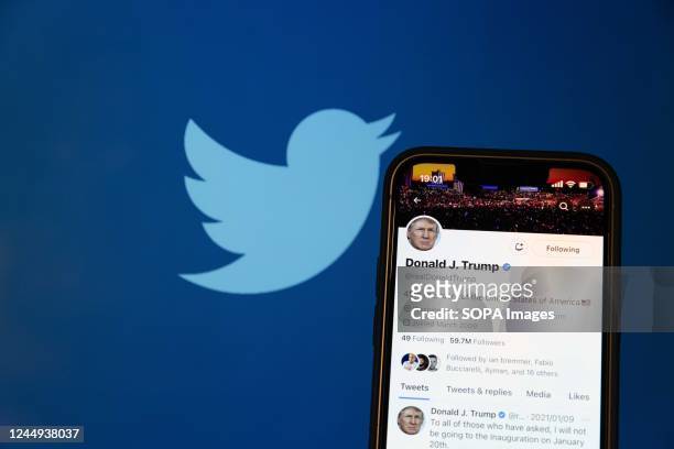 In this photo illustration, a reactivated Twitter profile of the former US President Donald Trump. Elon Musk reinstated him back on the social media...