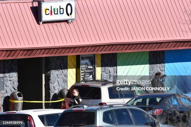 Law enforcement officers document evidence in the parking lot the morning after a mass shooting at Club Q, an LGBTQ nightclub in Colorado Springs,...