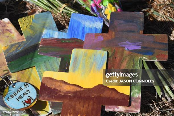 Painted crosses are placed at a memorial for the victims of the mass shooting at Club Q, an LGBTQ nightclub, in Colorado Springs, Colorado, on...