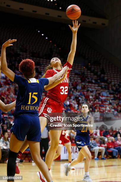 Indiana Hoosiers forward Alyssa Geary goes up with her shot from the lane over Quinnipiac Bobcats forward Cur'Tiera Haywood during a womens college...