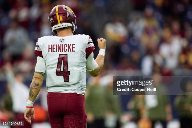 Taylor Heinicke of the Washington Commanders celebrates after a play against the Houston Texans at NRG Stadium on November 20, 2022 in Houston, Texas.