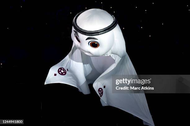 Performers perform as an image of La'eeb, the mascot of the Qatar 2022 World Cup is seen during the opening ceremony prior to the FIFA World Cup...