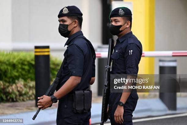 Members of the Royal Malaysia Police guard the entrance towards the National Palace in Kuala Lumpur on November 21, 2022. - In a bid to break the...