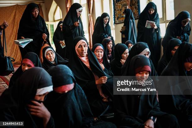 Afghan girls attend a religious school, the only permitted form of education for girls between the ages of 6th and 12th grade, at Hawza Elmya Mahdia...