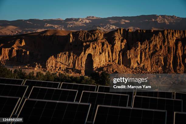 Sun rise illuminate the Buddhas with solar panels in the foreground, in Bamyan, Afghanistan, Monday, Sept. 5, 2022.