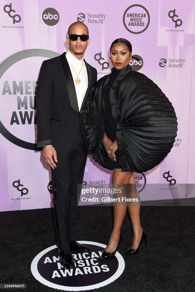 Raysean Hairston and Muni Long at the 2022 American Music Awards held ...