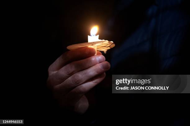 Community members attend a candlelight vigil at Temple Beit Torah in Colorado Springs, Colorado on November 20 to pay their respects to the victims...