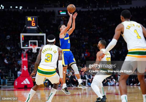 Stephen Curry of the Golden State Warriors shoots a three point shot in the fourth quarter of the game against the Houston Rockets at Toyota Center...