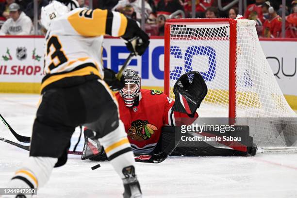 Arvid Soderblom of the Chicago Blackhawks makes a save on a shot from Brock McGinn of the Pittsburgh Penguins in the third period on November 20,...
