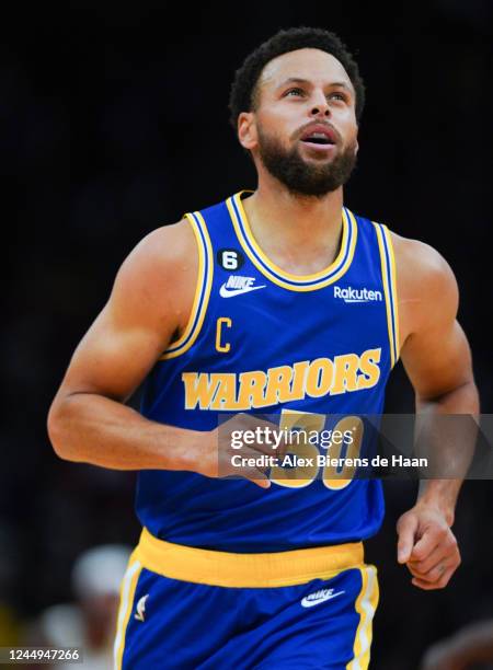 Stephen Curry of the Golden State Warriors runs down the court after making a shot during the game against the Houston Rockets at Toyota Center on...