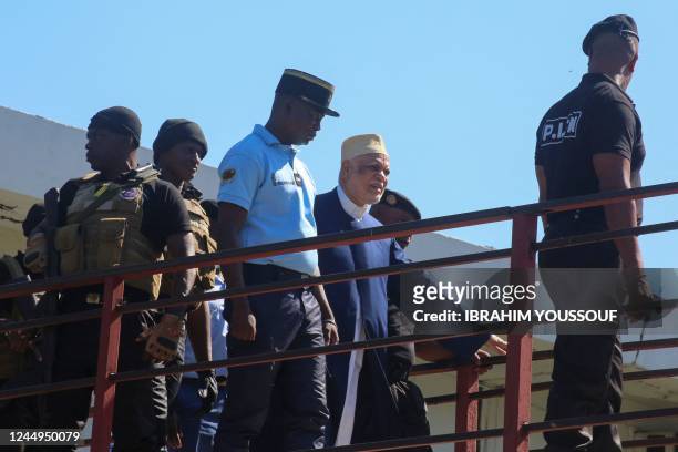 Former Comorian President Ahmed Abdallah Sambi , escorted by Gendarmes, arrives at the courthouse in Moroni on November 21, 2022. - Sambi, who served...