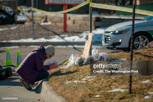 An unidentified woman at the site where people began placing flowers at the police tape for a growing memorial related to the shooting inside Club O...