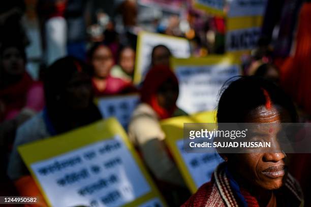 Scheme workers consisting of ASHA , and Anganwadi, take part in a demonstration demanding better wages and facilities in New Delhi on November 21,...