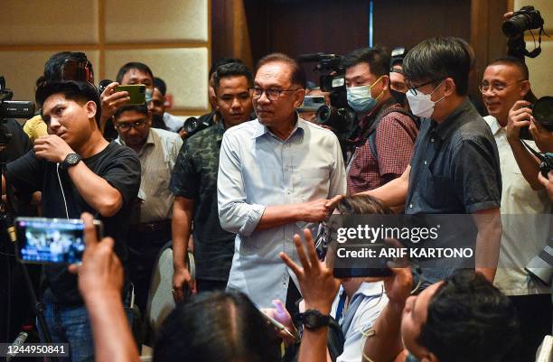 Malaysias opposition leader and chairman of Pakatan Harapan Anwar Ibrahim arrives to the press conference room in Kuala Lumpur, Malaysia on November...