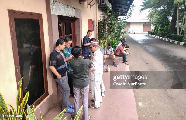 Employees gather outside a office in Bogor, West Java, Indonesia on November 21 shortly after a 5.6-magnitude earthquake struck off Cianjur Regency,...