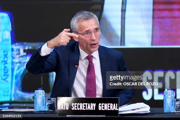 Secretary General Jens Stoltenberg gestures as speaks during NATO Parliamentary Assembly annual session held in Madrid on November 21, 2022.