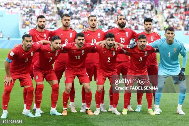 Iran national football team players pose ahead of the Qatar 2022 World Cup Group B football match between England and Iran at the Khalifa...