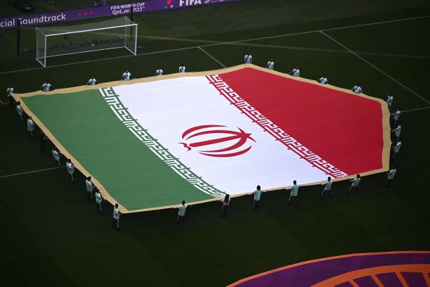 Giant national flag of Iran is displayed on the pitch at the Khalifa International Stadium before the start of the Qatar 2022 World Cup Group B...