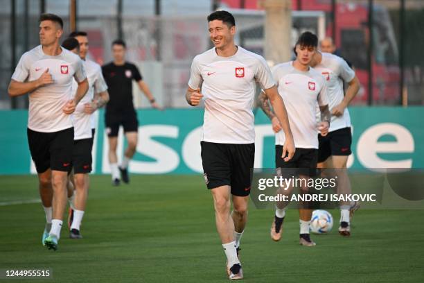 Poland's forward Robert Lewandowski takes part in a training session at the Al Kharaititat SC Training Site in Doha on November 21 on the eve of the...