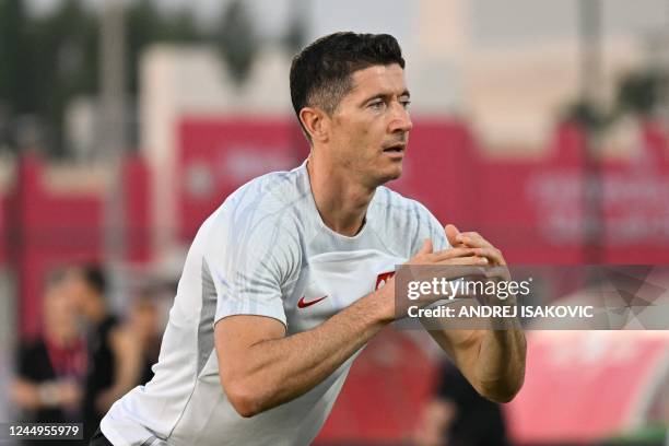 Poland's forward Robert Lewandowski takes part in a training session at the Al Kharaititat SC Training Site in Doha on November 21 on the eve of the...