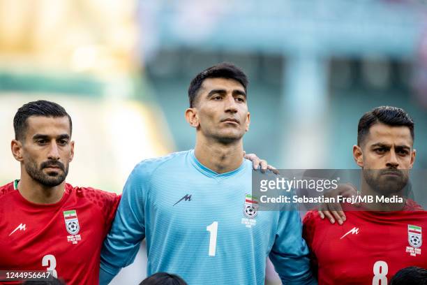 Iran players Ehsan Hajsafi, Alireza Beiranvand and Morteza Pouraliganji dont sing the national anthem before the FIFA World Cup Qatar 2022 Group B...