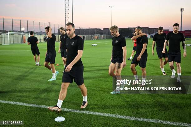 Denmark's midfielder Christian Eriksen and teammates take part in a training session at the al Sailiya SC Training Site in Doha on November 21 on the...