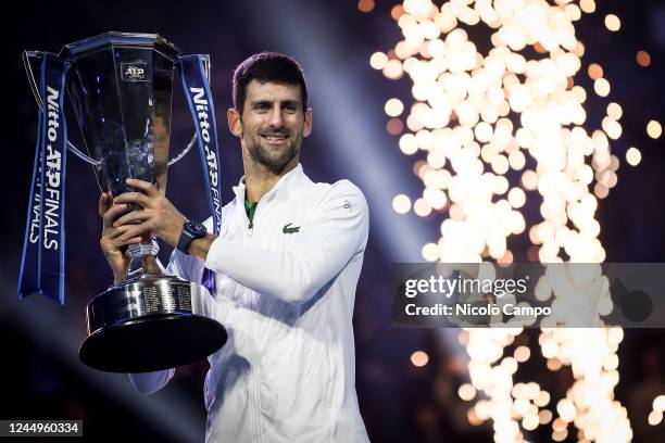 Novak Djokovic of Serbia celebrates with the trophy after the final match against Casper Ruud of Norway during day eight of the Nitto ATP Finals....