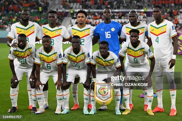 Senegal national team players pose ahead of the Qatar 2022 World Cup Group A football match between Senegal and the Netherlands at the Al-Thumama...