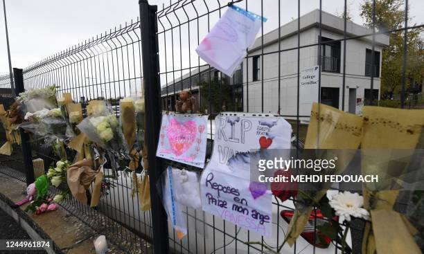 Photo shows flowers on the gates of Germillac College on November 21, 2022 in Tonneins, southwestern France, after a 14-year-old girl was kidnapped...