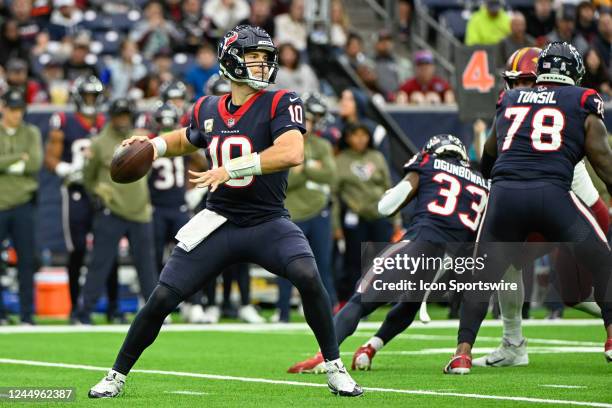 Houston Texans quarterback Davis Mills looks to throw downfield during the football game between the Washington Commanders and Houston Texans at NRG...