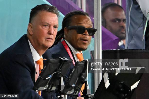 Netherlands' coach Louis Van Gaal and former Netherlands player Edgar Davids watch players from the touchline during the Qatar 2022 World Cup Group A...