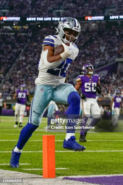 Dallas Cowboys running back Tony Pollard scores a touchdown on the end of a 30-yard reception from Dallas Cowboys quarterback Dak Prescott during the...