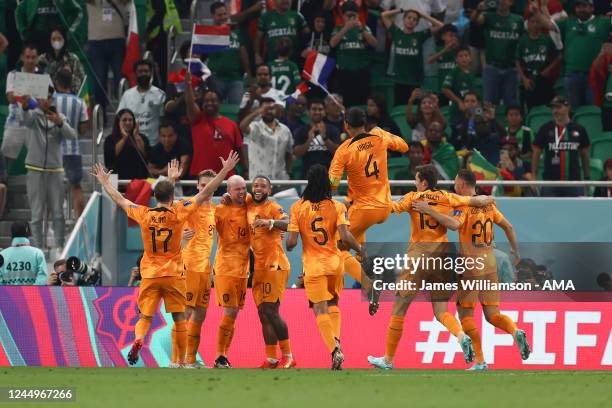 Davy Klaassen of Netherlands celebrates with his team mates after scoring a goal to make it 0-2 during the FIFA World Cup Qatar 2022 Group A match...