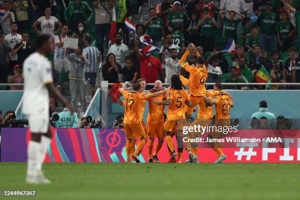 Davy Klaassen of Netherlands celebrates with his team mates after scoring a goal to make it 0-2 during the FIFA World Cup Qatar 2022 Group A match...