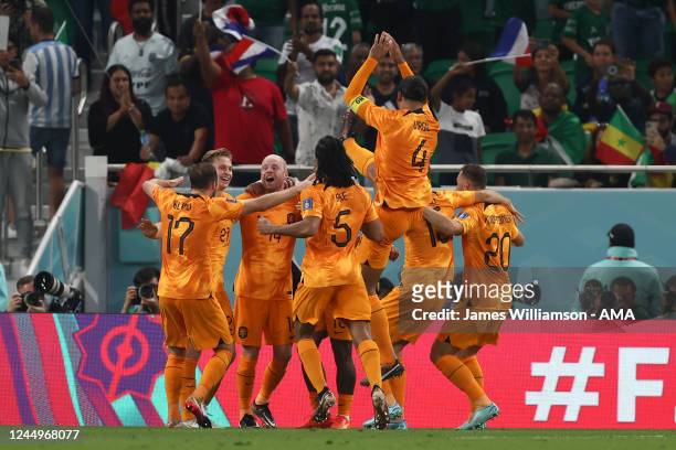 Davy Klaassen of Netherlands celebrates with his team mates after scoring a goal to make it 0-2 during the FIFA World Cup Qatar 2022 Group A match...