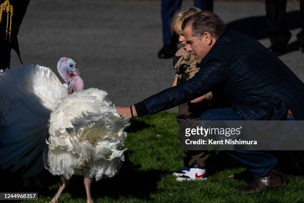 Hunter Biden, the son U.S. President Joe Biden, holds his son Beau as they look at the National Thanksgiving Turkeys Chocolate and Chip on the South...