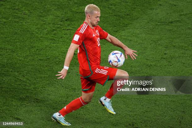 Wales' midfielder Aaron Ramsey controls the ball during the Qatar 2022 World Cup Group B football match between USA and Wales at the Ahmad Bin Ali...