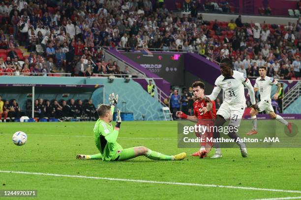 Timothy Weah of United States of America scores a goal to make it 1-0 during the FIFA World Cup Qatar 2022 Group B match between USA and Wales at...