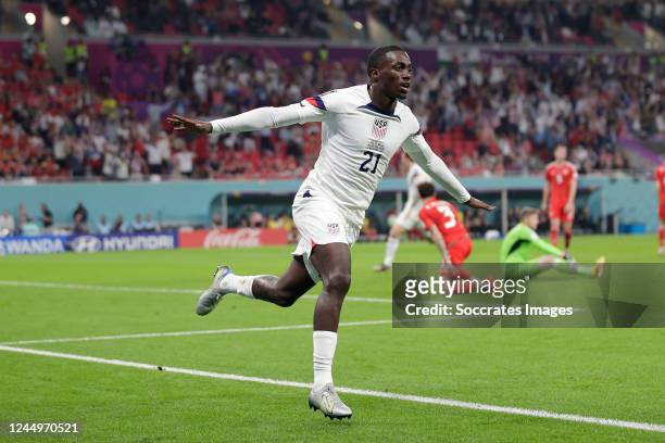 Timothy Weah of USA celebrates 1-0 during the World Cup match between USA v Wales at the Ahmad Bin Ali Stadium on November 21, 2022 in Al Rayyan Qatar
