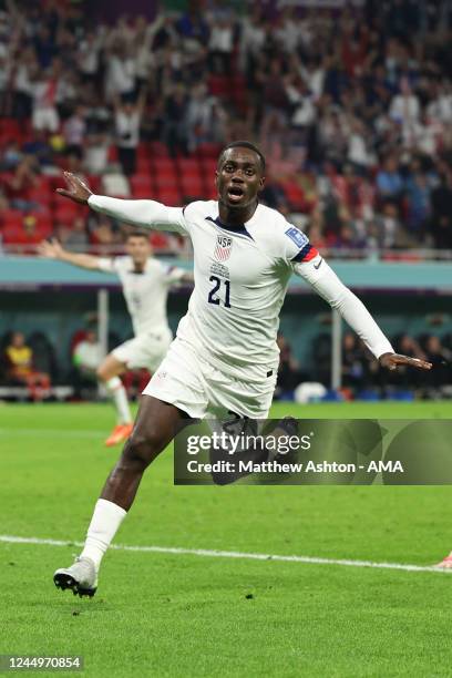 Timothy Weah of United States of America celebrates after scoring a goal to make it 1-0 during the FIFA World Cup Qatar 2022 Group B match between...
