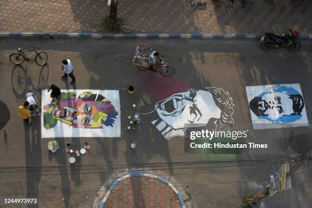Members of Patuli Sports Lover paint face of football players Messi, Ronaldo, Neymar on street with to celebrate Qatar World Cup 2022 on November 21,...