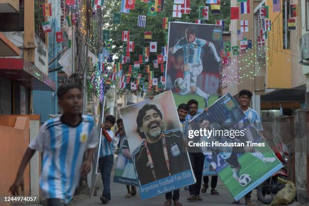 Members of Argentina fan Club with players poster celebrate day before Argentina's first play in Qatar World Cup 2022 on November 21, 2022 in...